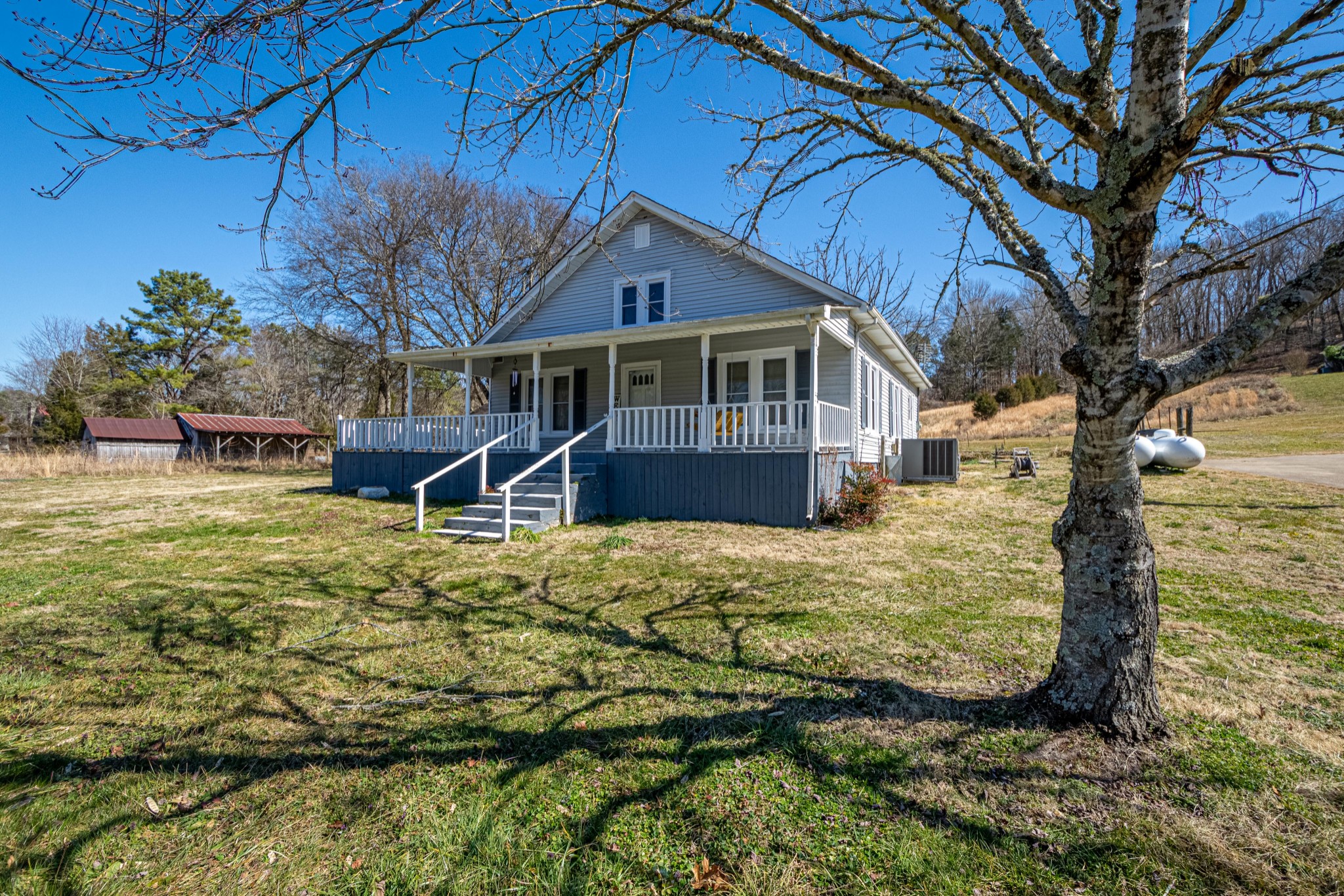 9263 Bethel Road Prospect, TN 38477 - Photo 1 of 45 a front view of a house with garden