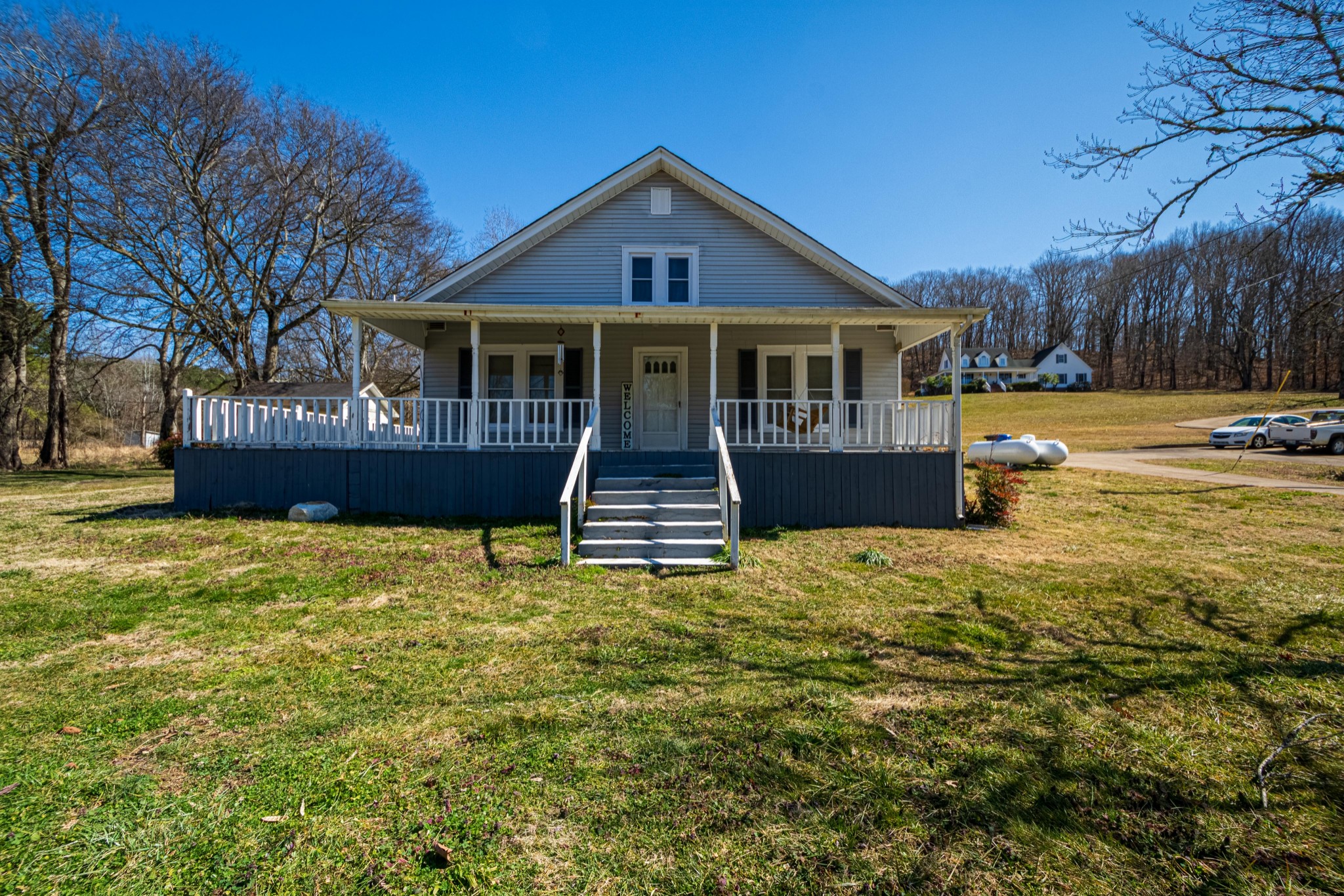9263 Bethel Road Prospect, TN 38477 - Photo 2 of 45 a front view of a house with a yard