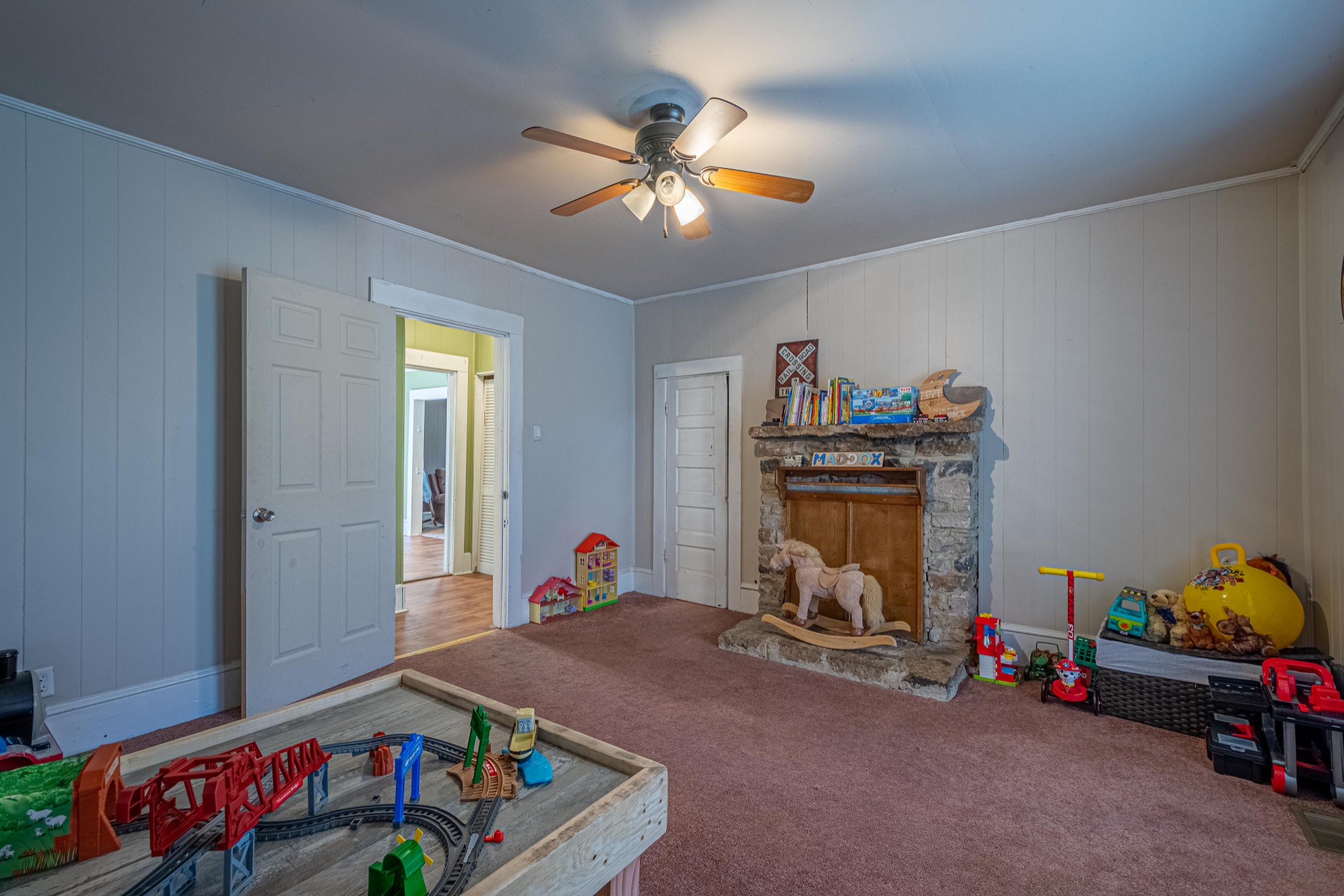 9263 Bethel Road Prospect, TN 38477 - Photo 20 of 45 a bed room with a bed and a chandelier