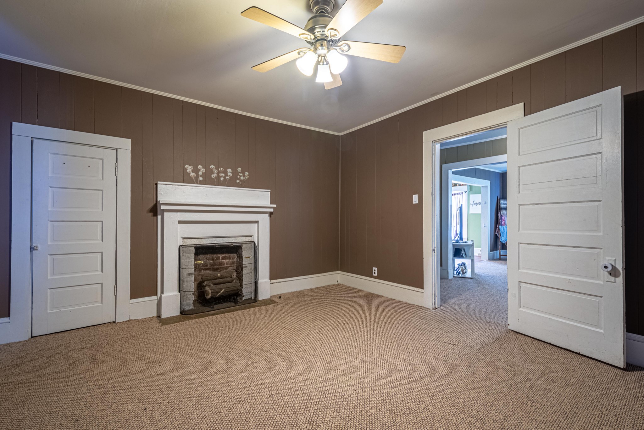 9263 Bethel Road Prospect, TN 38477 - Photo 26 of 45 a view of empty room with a fireplace and ceiling fan