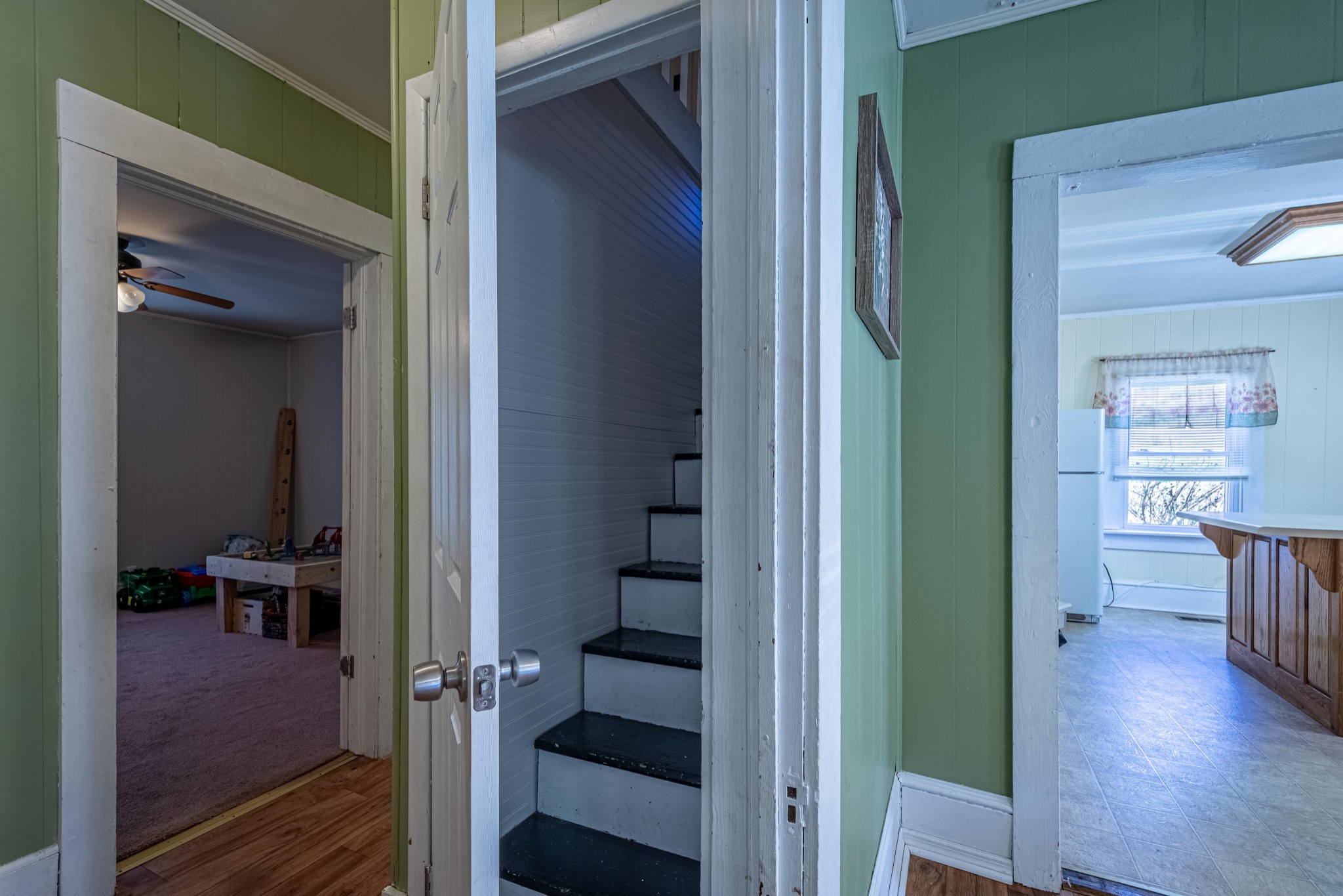 9263 Bethel Road Prospect, TN 38477 - Photo 28 of 45 a view of a hallway with wooden floor stairs and furniture