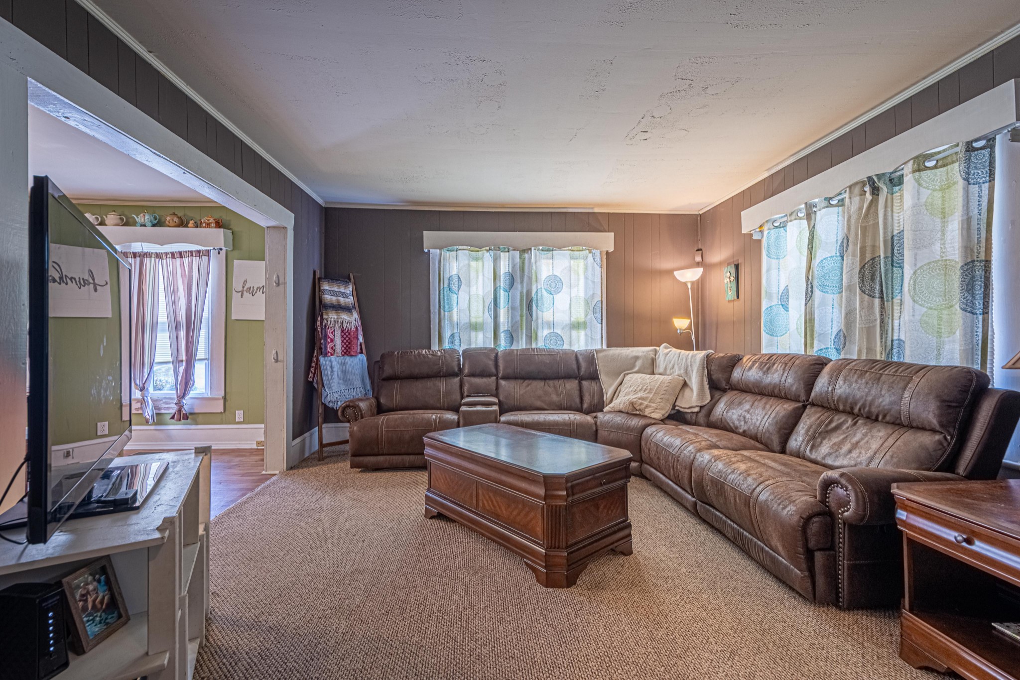 9263 Bethel Road Prospect, TN 38477 - Photo 5 of 45 a living room with furniture and a flat screen tv