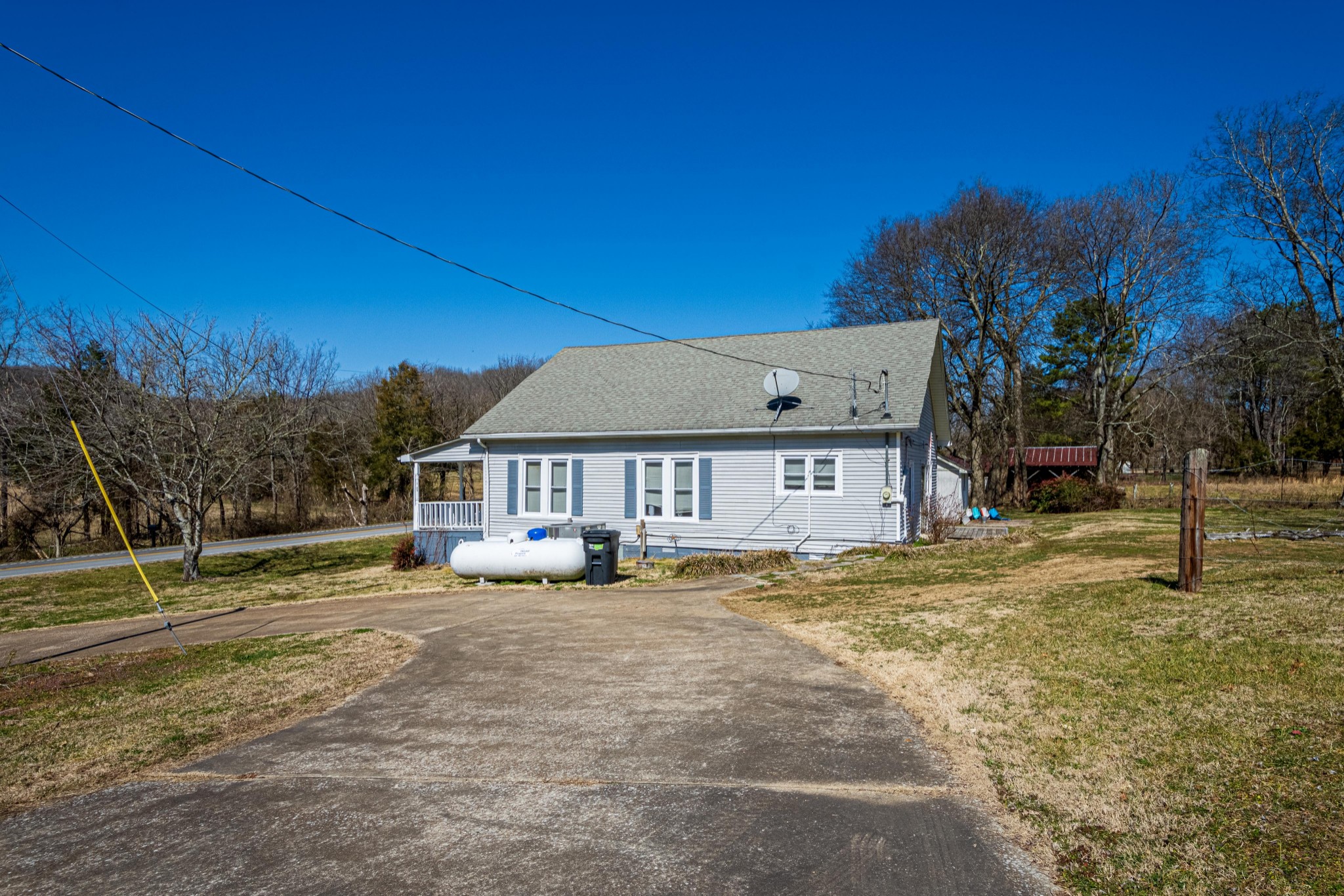 9263 Bethel Road Prospect, TN 38477 - Photo 42 of 45 a house with trees in front of it