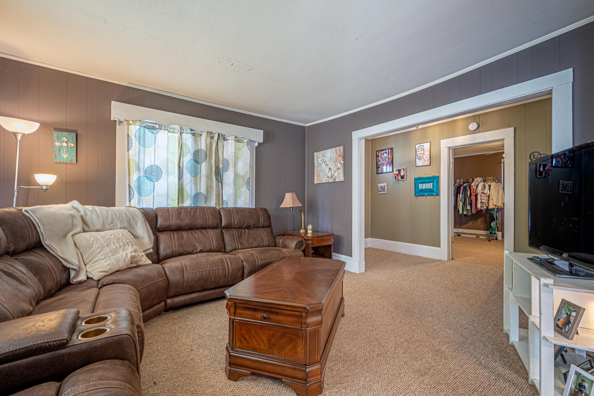 9263 Bethel Road Prospect, TN 38477 - Photo 8 of 45 a living room with furniture and a flat screen tv