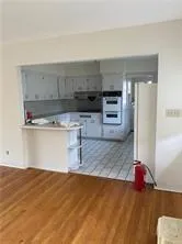 a kitchen with a stove and a refrigerator