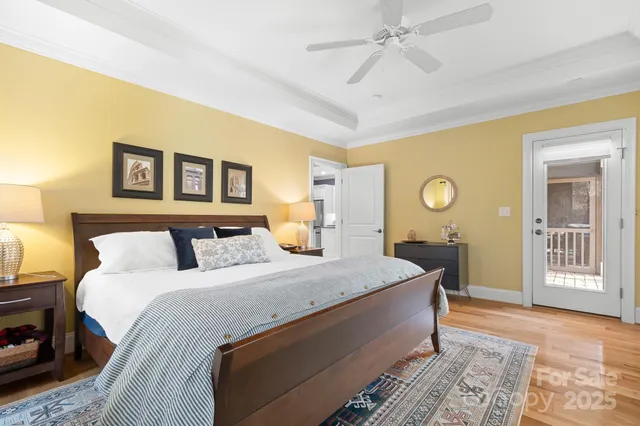 a bed room with a bed and a chandelier