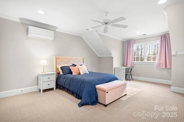 a bedroom with a bed and window