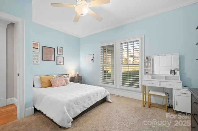 a bedroom with a bed and a chair