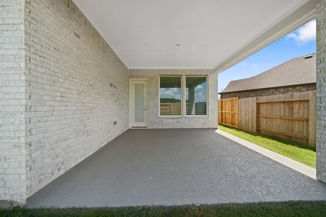 a view of an empty room with a window and balcony
