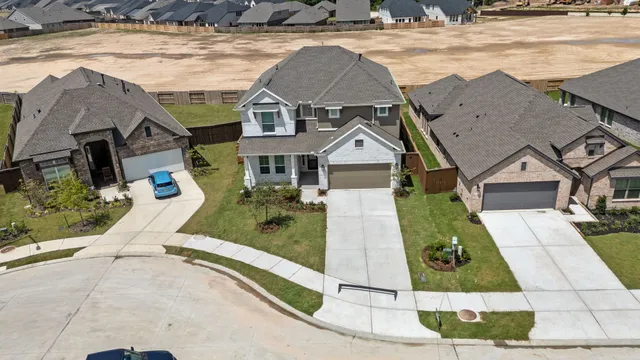a aerial view of a house with a yard