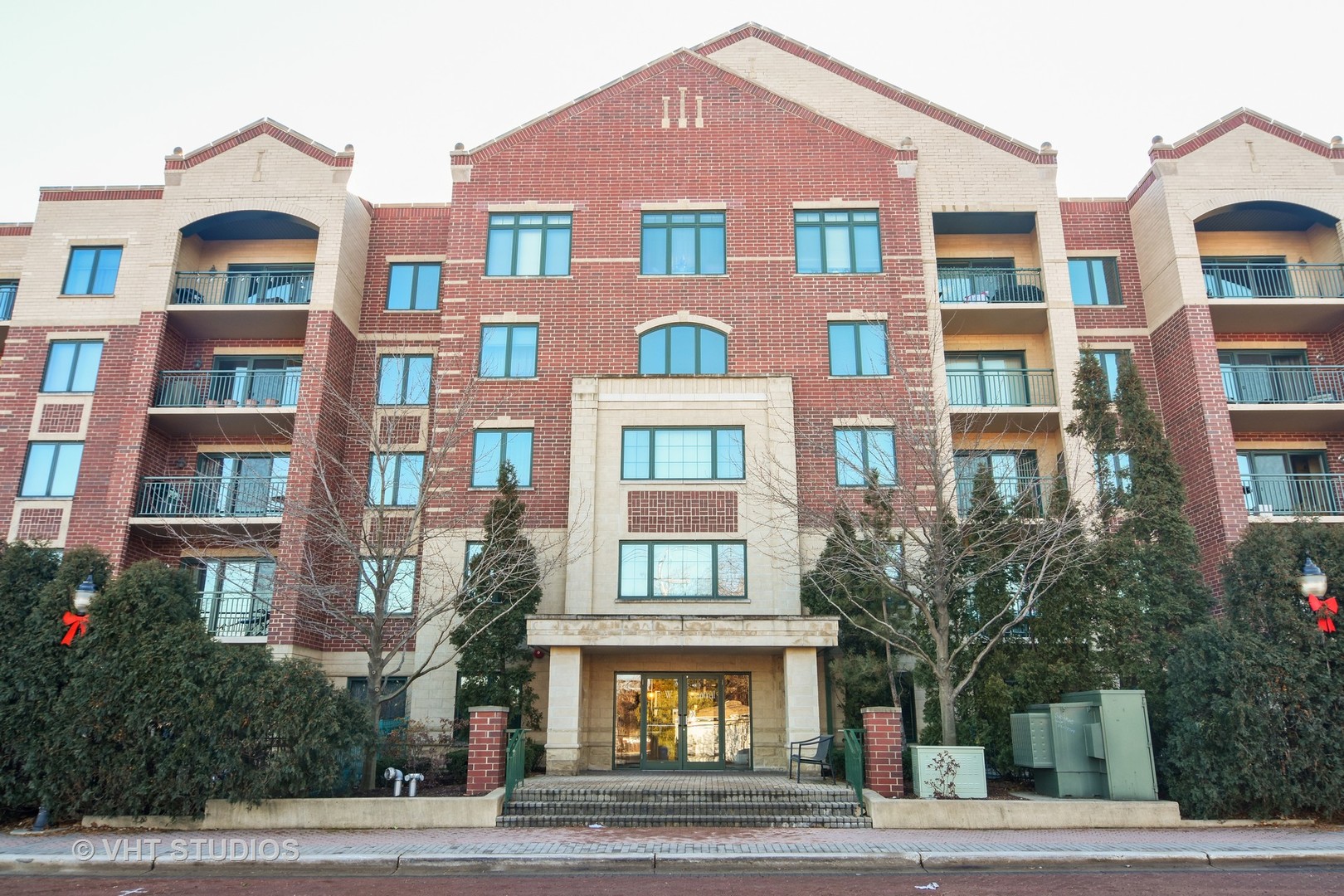 5 West Central Road, Unit 412 Mount Prospect, IL 60056 - Photo 1 of 10 a front view of multi story residential apartment building