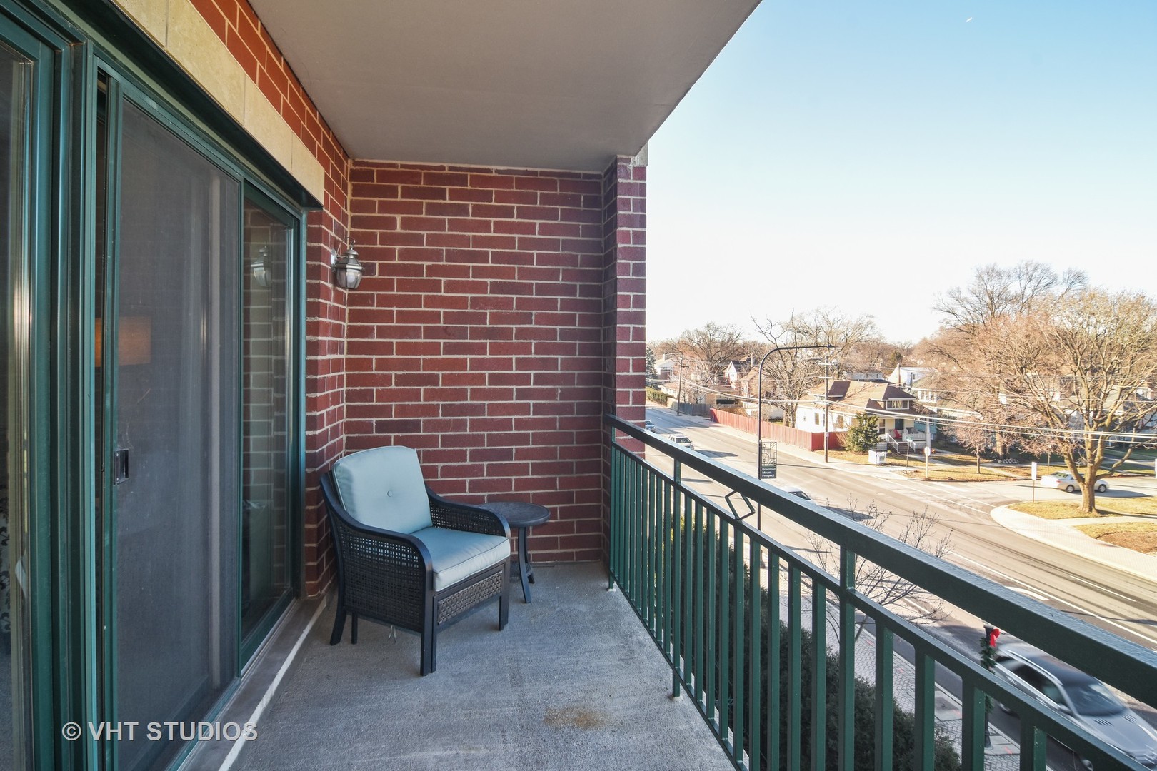 5 West Central Road, Unit 412 Mount Prospect, IL 60056 - Photo 10 of 10 a view of a balcony with chair and wooden floor