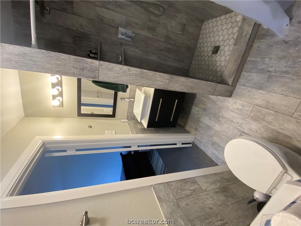 300 Cooner Street College Station, TX 77840 - Photo 6 of 9 a bathroom with a sink a toilet and shower