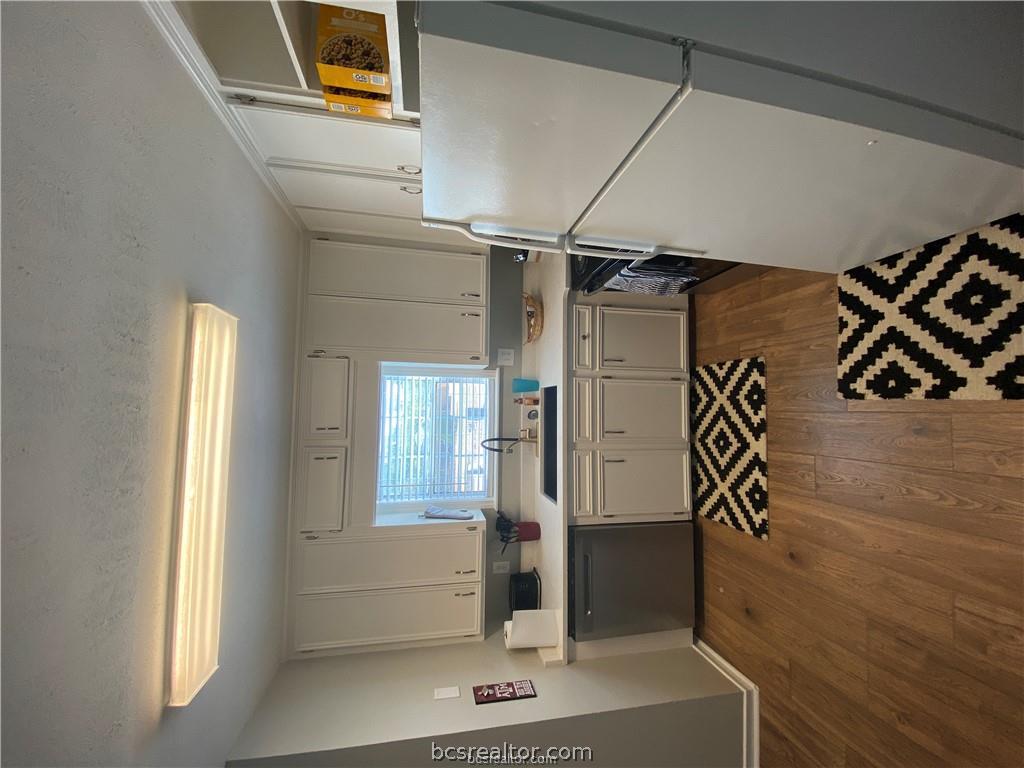 300 Cooner Street College Station, TX 77840 - Photo 9 of 9 a kitchen with a refrigerator a sink and a stove top oven