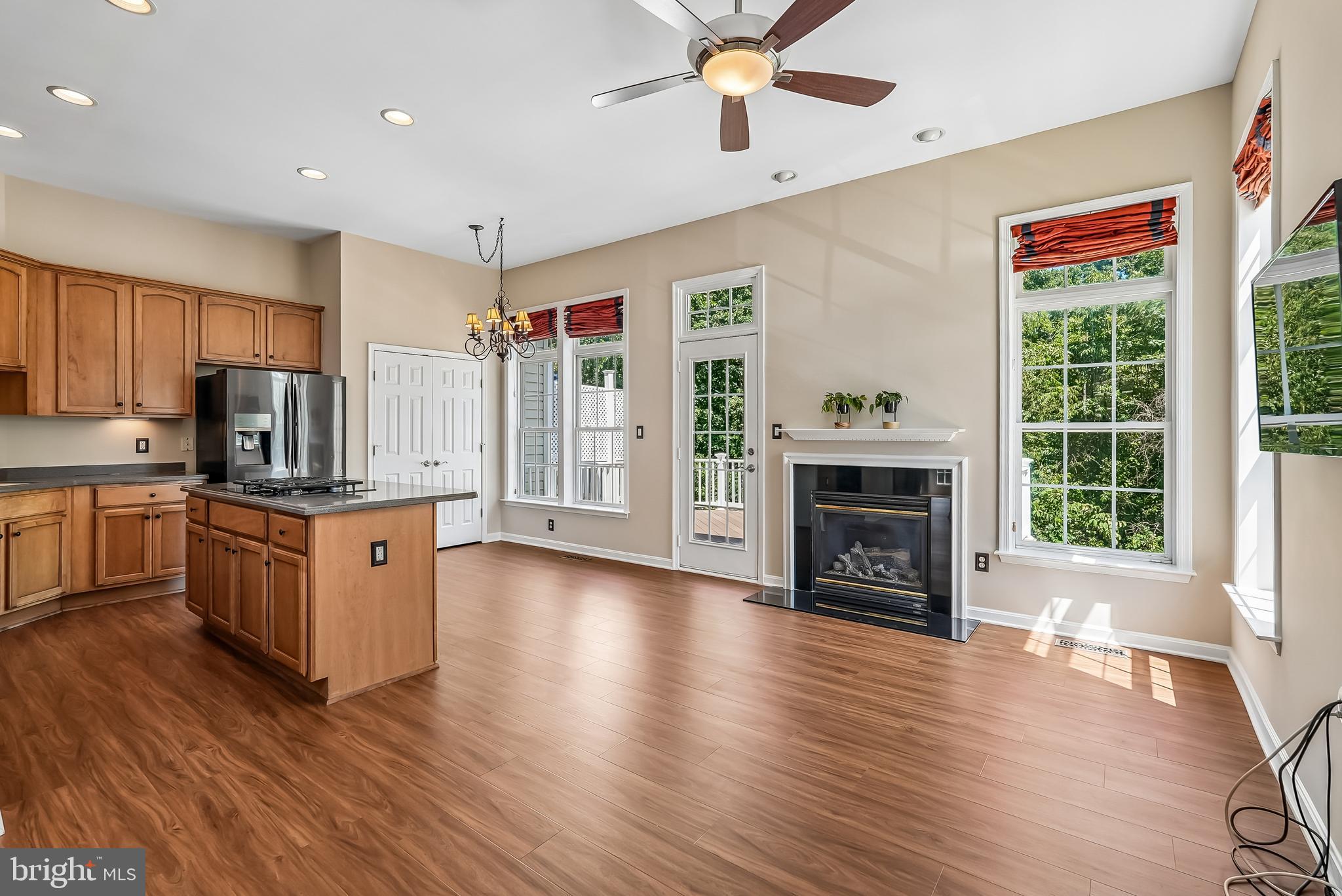 41935 Cinnabar Square Aldie, VA 20105 - Photo 12 of 39 Eat- In Kitchen with Gas Fireplace and deck access