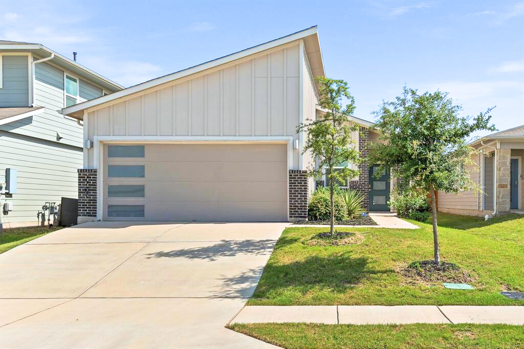 a house with garden in front of it