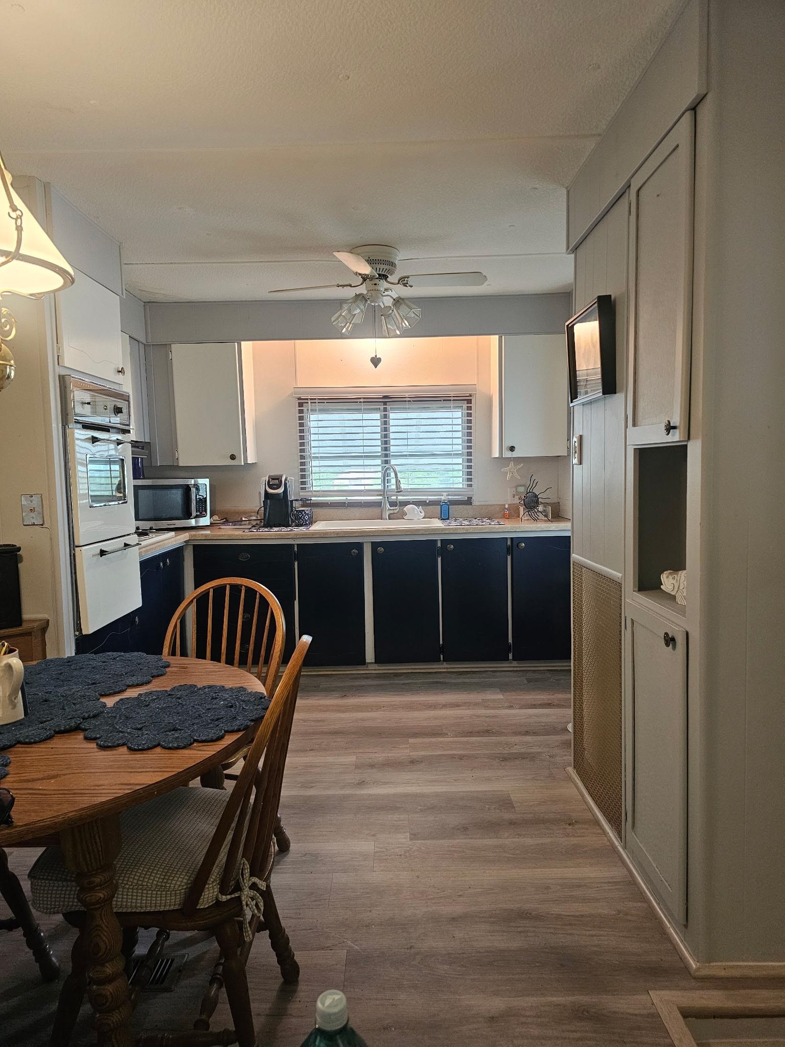 614 South Rte 9 Cape May Court House, NJ 08210 - Photo 6 of 9 a kitchen with stainless steel appliances granite countertop a dining table chairs and granite counter tops