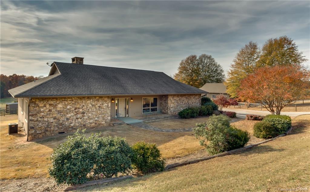 610 Phillips Road Columbus, NC 28722 - Photo 1 of 24 a front view of a house with a yard