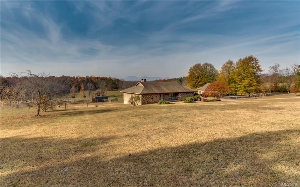 610 Phillips Road Columbus, NC 28722 - Photo 2 of 24 a view of a house with a yard