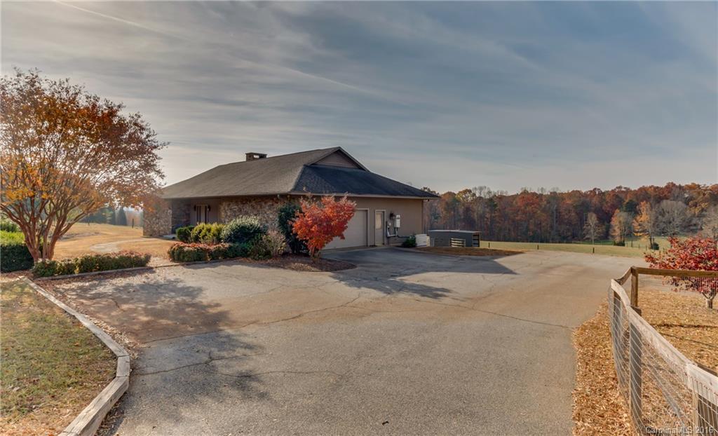 610 Phillips Road Columbus, NC 28722 - Photo 17 of 24 a view of a house with wooden floor and a large tree