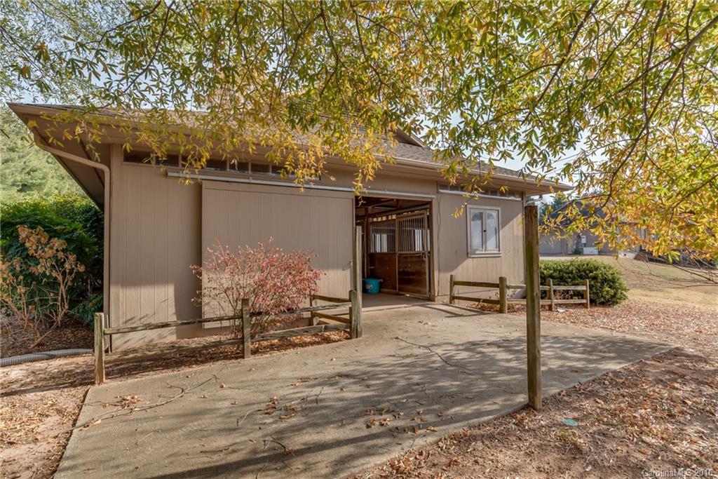 610 Phillips Road Columbus, NC 28722 - Photo 21 of 24 a view of a house with backyard porch and sitting area