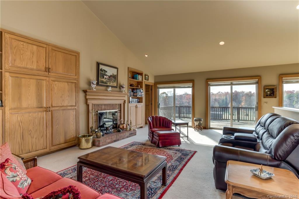 610 Phillips Road Columbus, NC 28722 - Photo 4 of 24 a living room with furniture large window and a fireplace