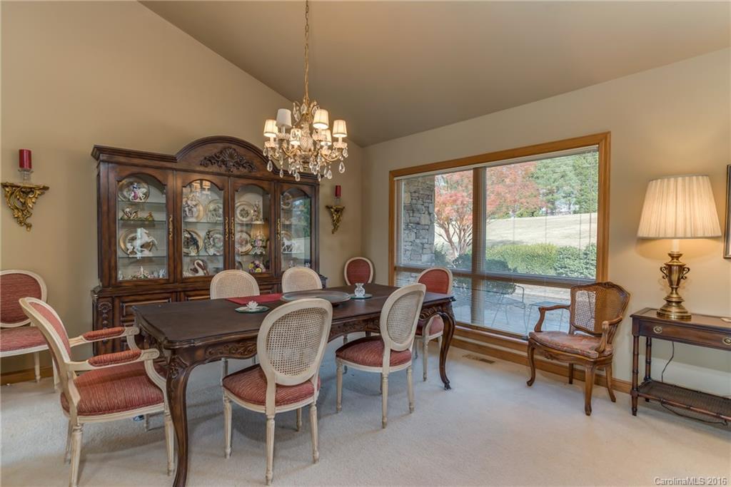 610 Phillips Road Columbus, NC 28722 - Photo 5 of 24 a dining room with furniture a chandelier and window