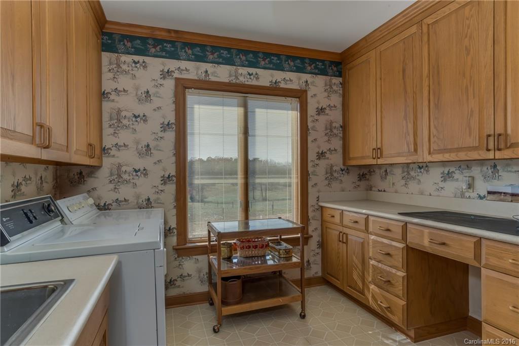 610 Phillips Road Columbus, NC 28722 - Photo 9 of 24 a kitchen with a stove and a sink
