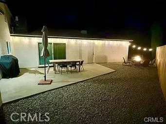 a view of house with backyard and entertaining space