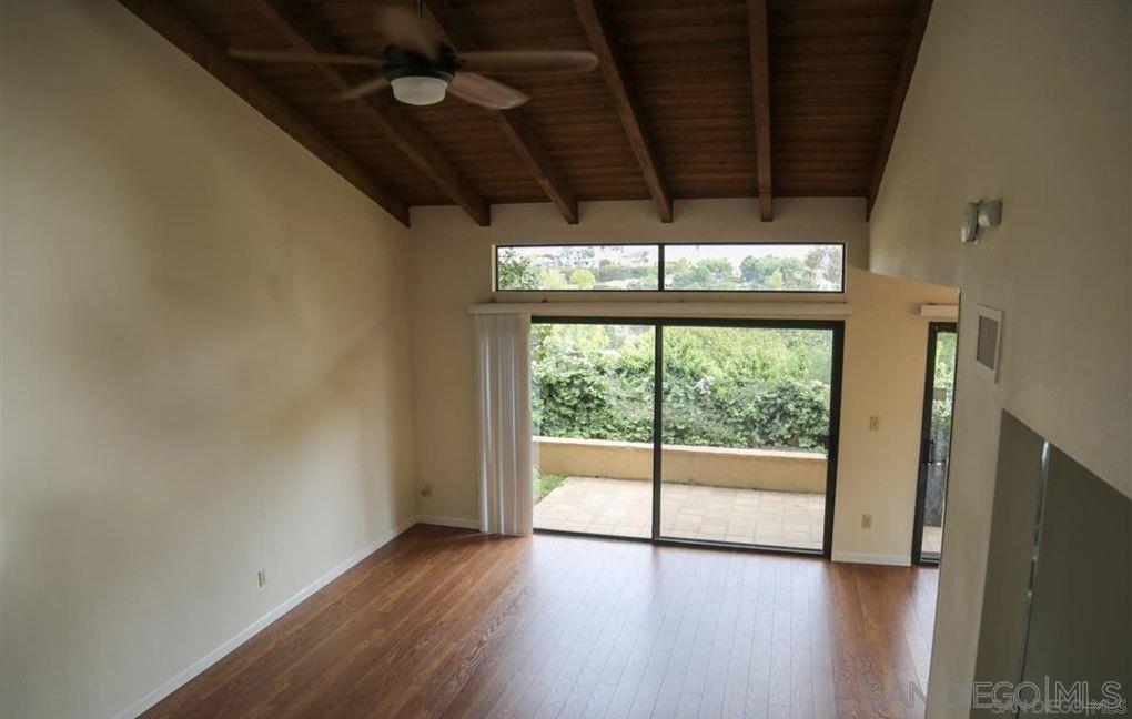 6555 Caminito Scioto La Jolla, CA 92037 - Photo 2 of 12 a view of empty room with wooden floor and fan