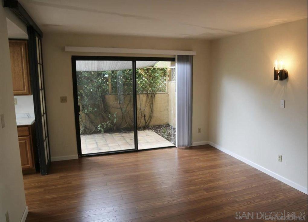 6555 Caminito Scioto La Jolla, CA 92037 - Photo 5 of 12 wooden floor in an empty room with a window