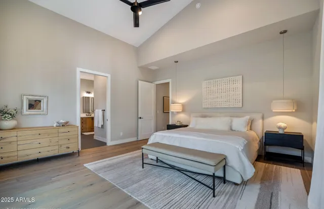 a kitchen with granite countertop white cabinets and window