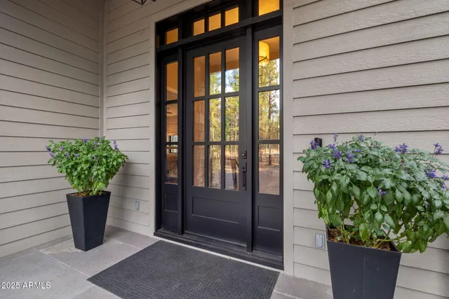 a view of a livingroom with furniture and a large window