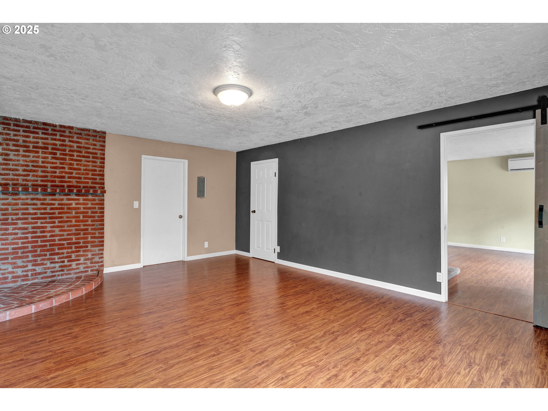 2850 Garfield Street Eugene, OR 97405 - Photo 13 of 46 a view of an empty room with wooden floor