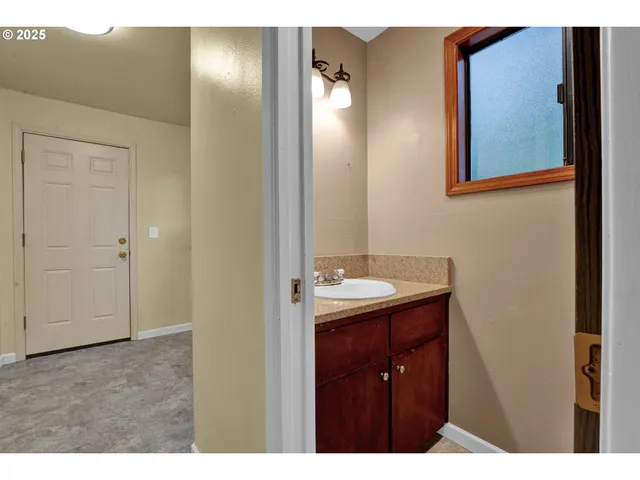 a bathroom with a sink and mirror