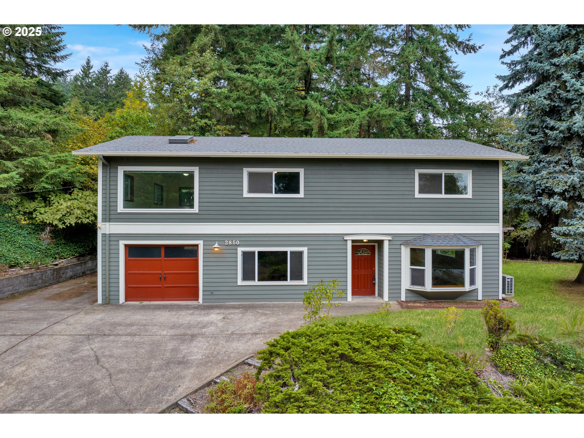 2850 Garfield Street Eugene, OR 97405 - Photo 2 of 46 a front view of a house with a yard