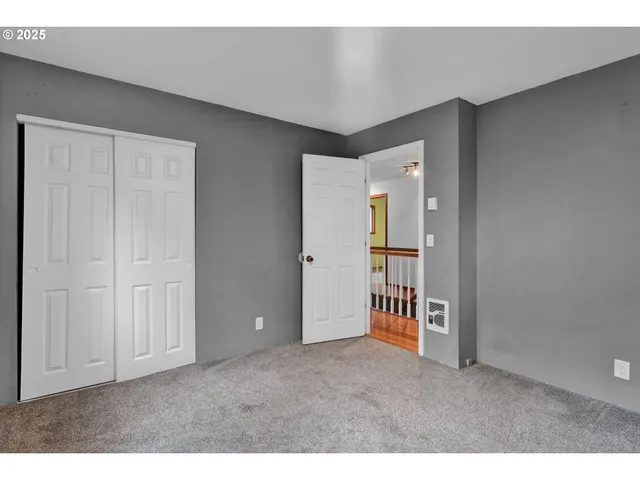 a big room with closet and windows