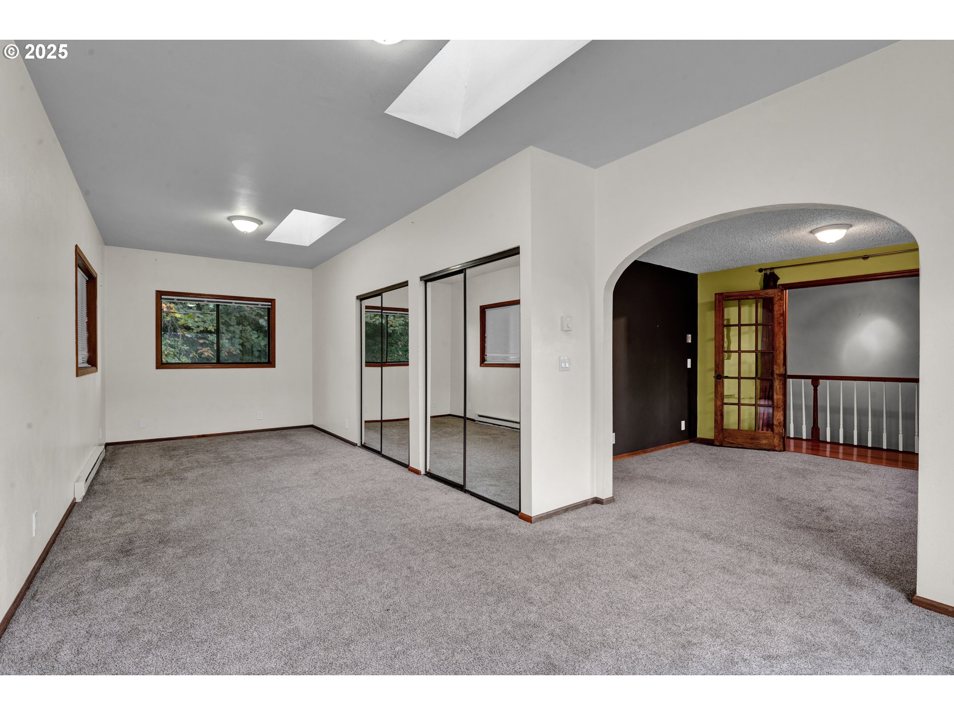2850 Garfield Street Eugene, OR 97405 - Photo 28 of 46 a view of a big room with closet and windows