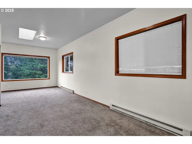 a view of a room that has a large window