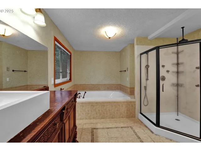 a bathroom with a glass shower door