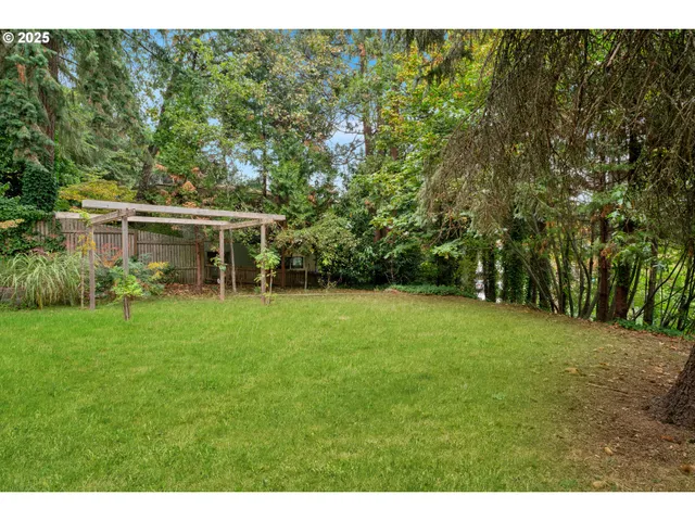 a view of a backyard of the house