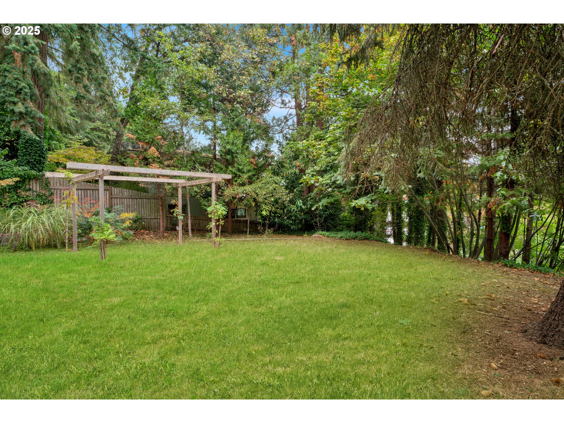 2850 Garfield Street Eugene, OR 97405 - Photo 38 of 46 a view of a house with a backyard