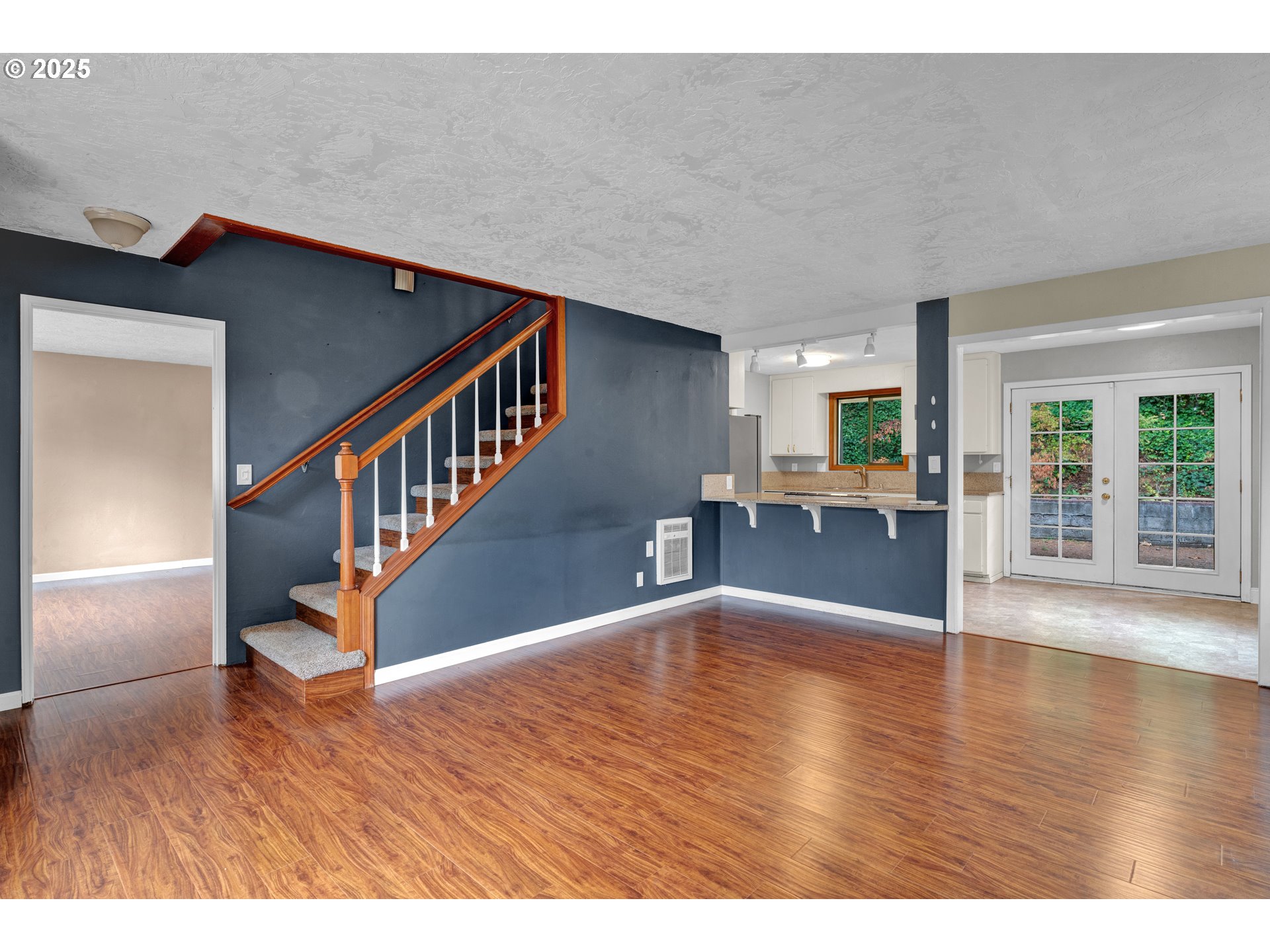 2850 Garfield Street Eugene, OR 97405 - Photo 5 of 46 a view of an entryway with wooden floor