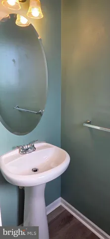 a bathroom with a sink and mirror
