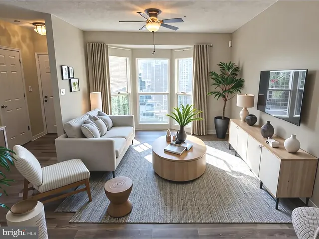 a living room with furniture and a large window