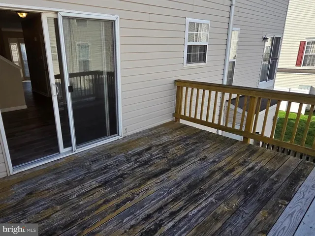a view of a balcony with wooden floor