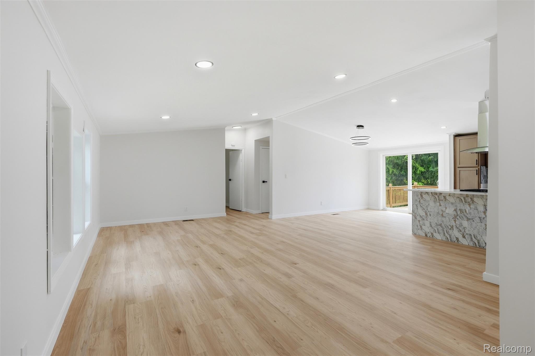 4420 Dublin Road Burton, MI 48529 - Photo 4 of 56 Bright open-concept interior featuring light wood-finish flooring, recessed lighting, and crisp white walls