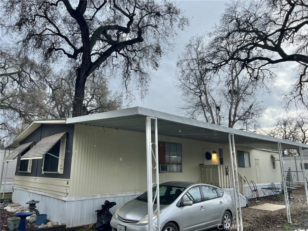 a view of a house with a car parked in it