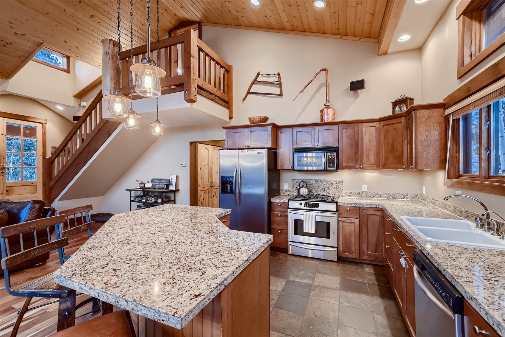 490 Adventure Road Alma, CO 80420 - Photo 12 of 28 Kitchen with a kitchen island, appliances with stainless steel finishes, high vaulted ceiling, and wooden ceiling