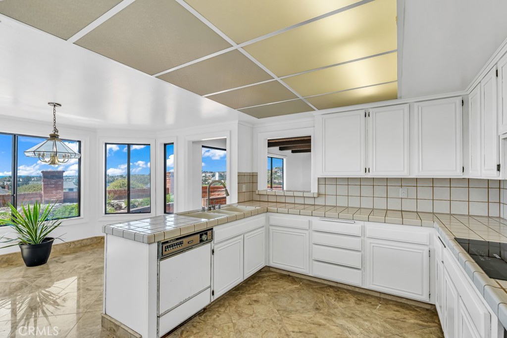 523 Calle Baranda San Clemente, CA 92673 - Photo 12 of 39 a kitchen with sink and stove
